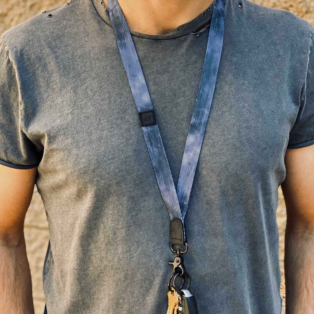 man wears cool navy neck lanyard for carrying keys