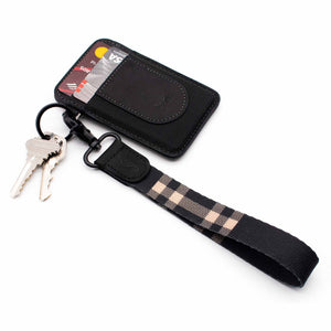 Black and cream color plaid hand wrist lanyard with keys and with black leather slim wallet