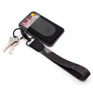 Black gray white hand wrist lanyard with keys and gray leather slim wallet
