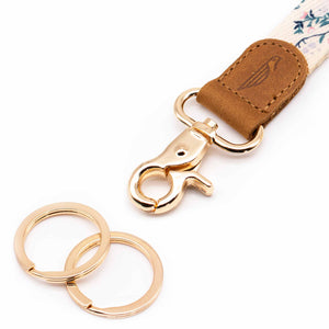 Close up lanyard with 2 gold metal key rings brown leather creme color fabric