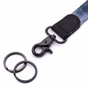 Close up lanyard with 2 black metal key rings black leather navy fabric