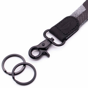 Close up lanyard with 2 black metal key rings black leather gray fabric